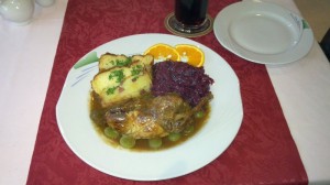 Grey Partridge stuffed with roe deer, red cabbage, and Thüringer Aschklöße